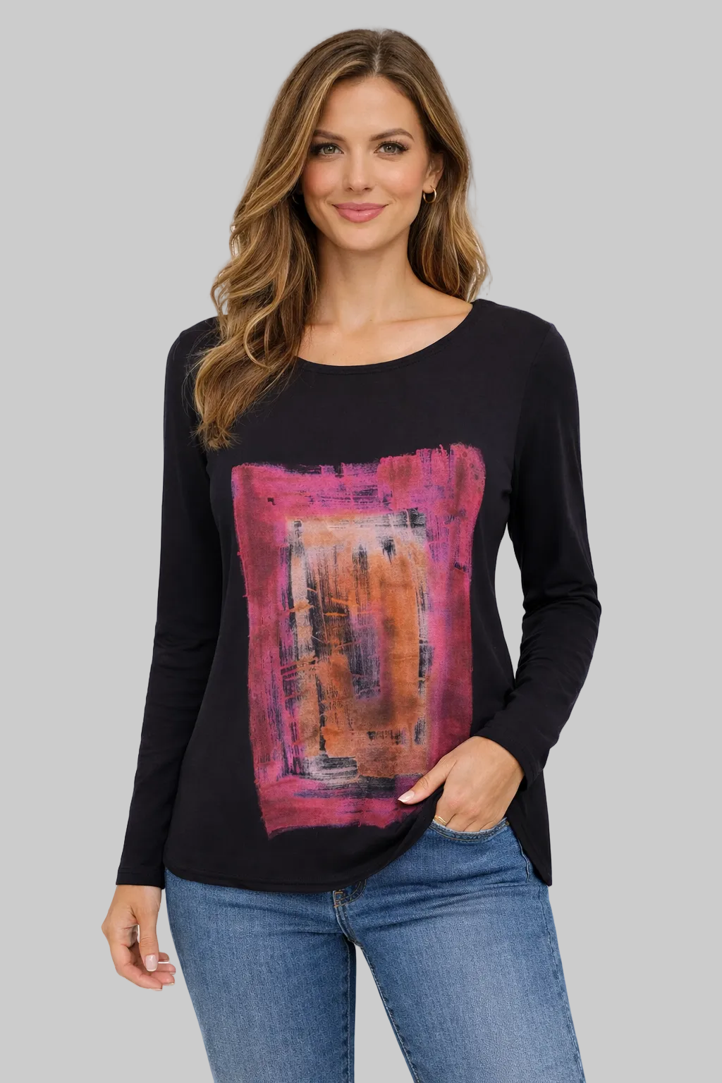 Woman wearing a black long-sleeve top with a colorful abstract design on a white background